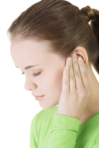 Young woman feeling a pain in ear